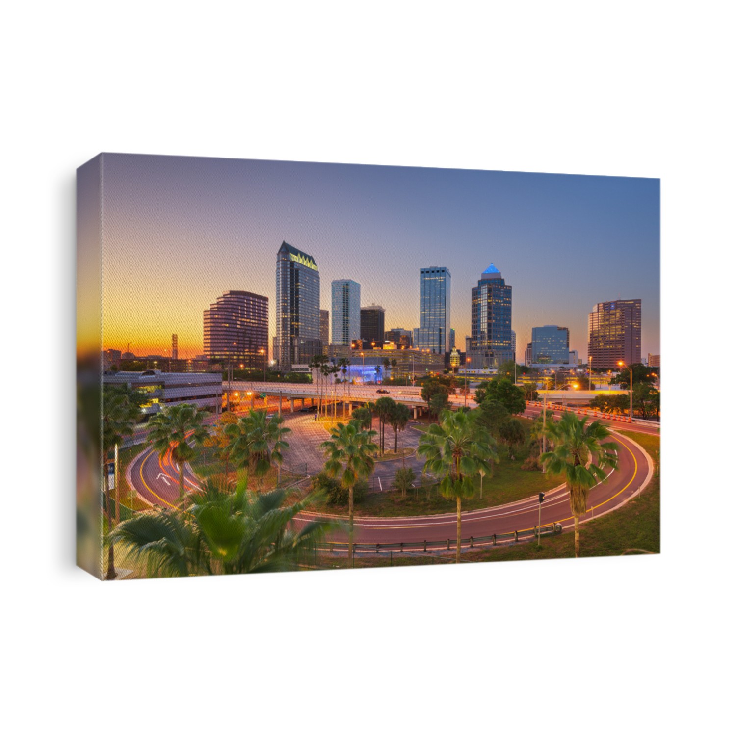 Tampa, Florida, USA downtown city skyline over roads and highways at dusk.